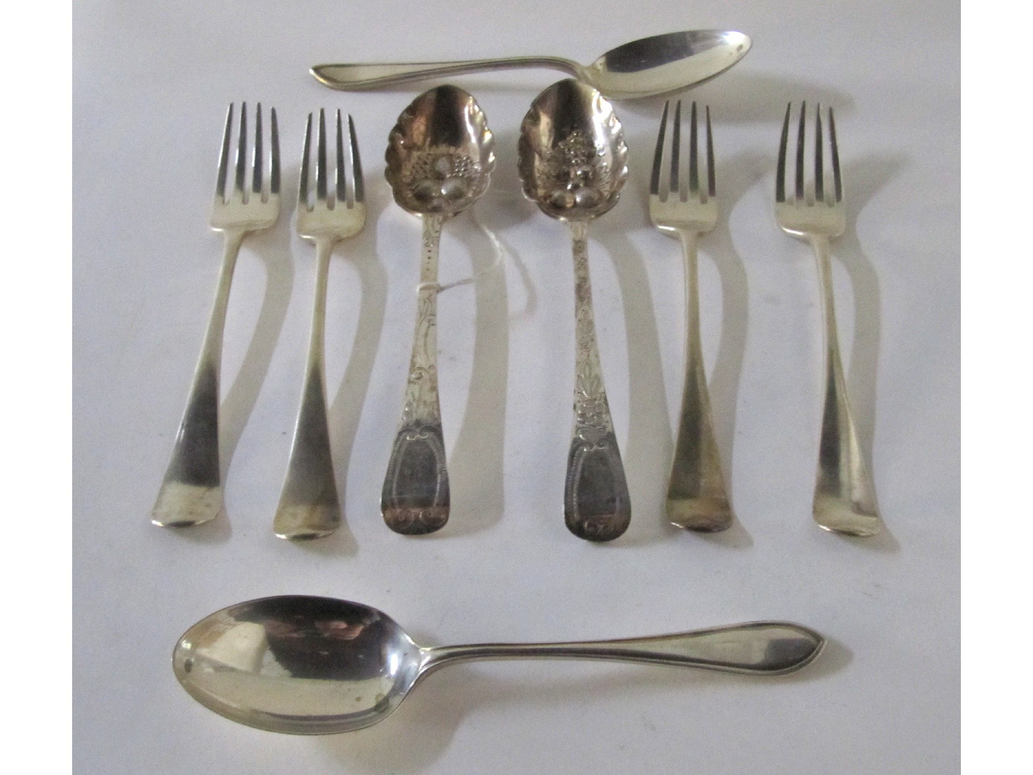 Appraisal: A lot comprising a pair of silver berry spoons London