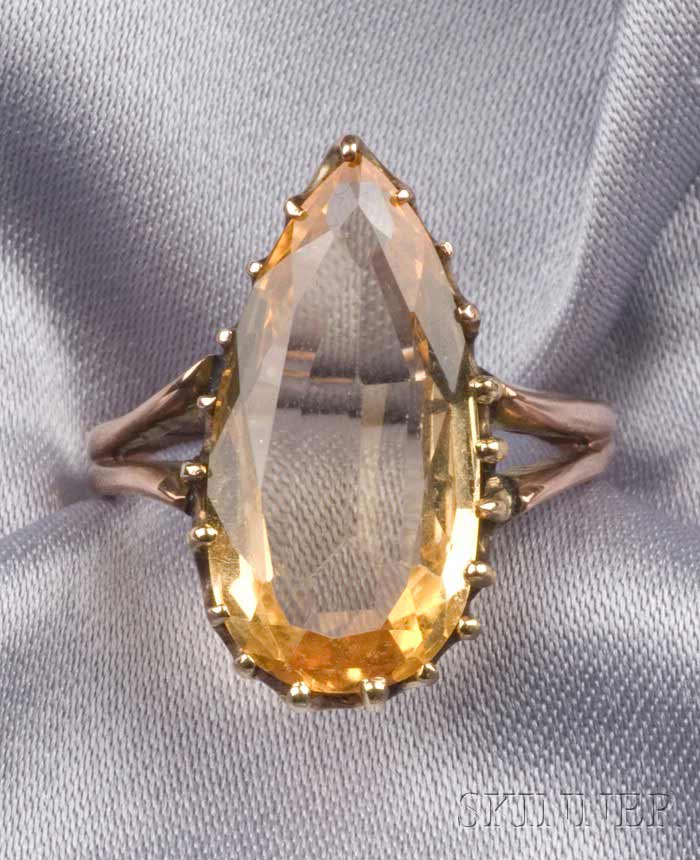 Appraisal: Antique Golden Topaz Ring prong-set with a pear-cut topaz split