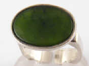 Appraisal: A white metal tests silver modernist jade ring jade approx