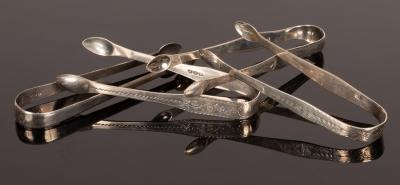 Appraisal: Four pairs of George III silver sugar tongs one by