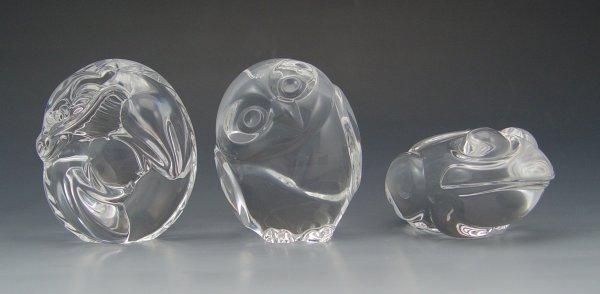 Appraisal: SIGNED STEUBEN GLASS HAND COOLERS Owl Frog and Dragon Each