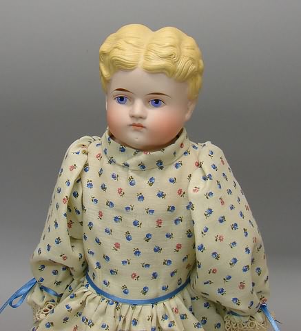 Appraisal: Unmarked shoulderhead doll with molded wavy blonde hair painted blue