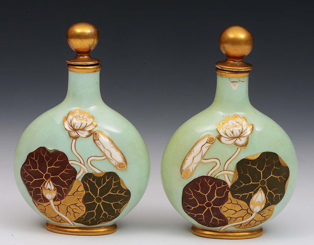 Appraisal: A pair of Coalport pale green ground scent bottles and