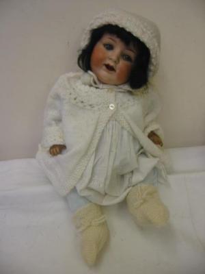 Appraisal: An Armand Marseille bisque head doll with blue sleeping eyes