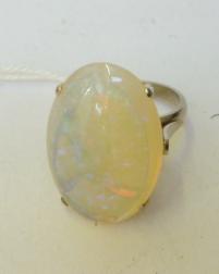 Appraisal: A LARGE OPAL DRESS RING the oval cabochon polished stone