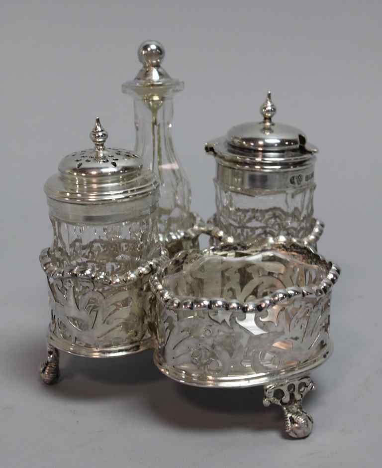 Appraisal: EDWARD VII SILVER ASSEMBLED CRUET STAND the frame London pots