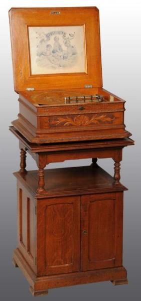 Appraisal: Criterion Double Comb Music Box Description Fancy heavily carved oak