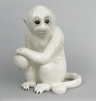 Appraisal: A Large Glazed Ceramic Monkey Holding a Ball Seated and