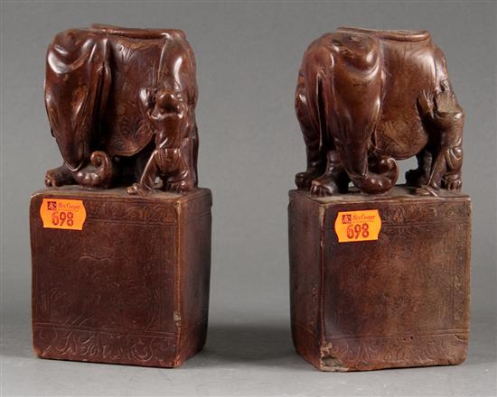 Appraisal: Pair of Chinese burnished earthenware bookends th Century modeled as