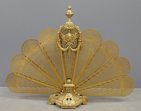 Appraisal: - Ornate French style pierced brass fan-shaped fire screen with