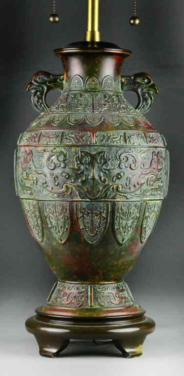 Appraisal: Chinese Bronze LampEgg-shaped bronze vase with embossed shield decoration having