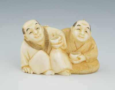 Appraisal: A Carved Ivory Netsuke of Two Men Drinking Carved depicting