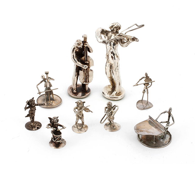 Appraisal: A SILVER MINIATURE CHERUB FOUR PIECE BAND each stamped makers