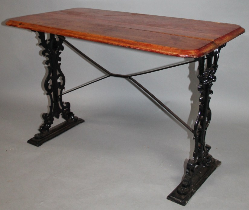 Appraisal: An early thC iron framed pub table with an oblong