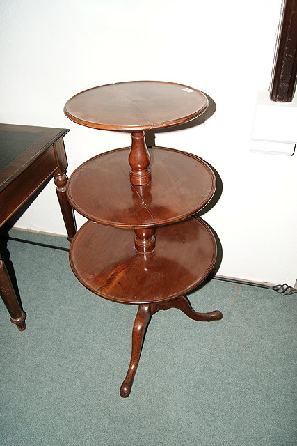 Appraisal: A TH CENTURY MAHOGANY THREE TIER DUMB WAITER on tripod