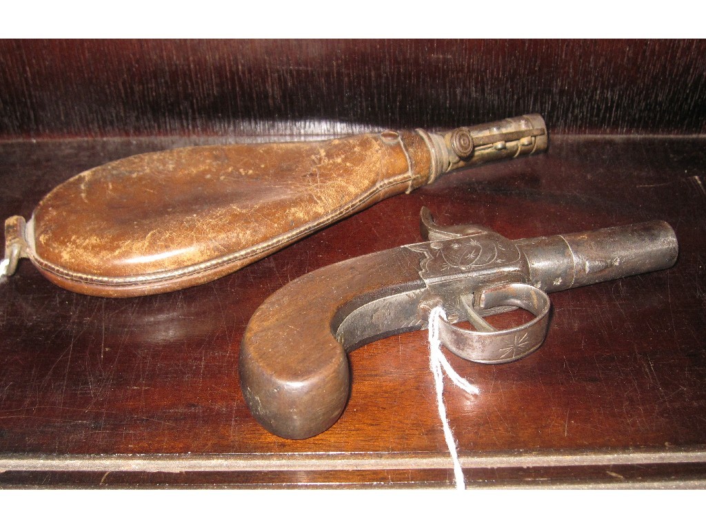 Appraisal: Lot comprising pocket pistol and leather shot flask