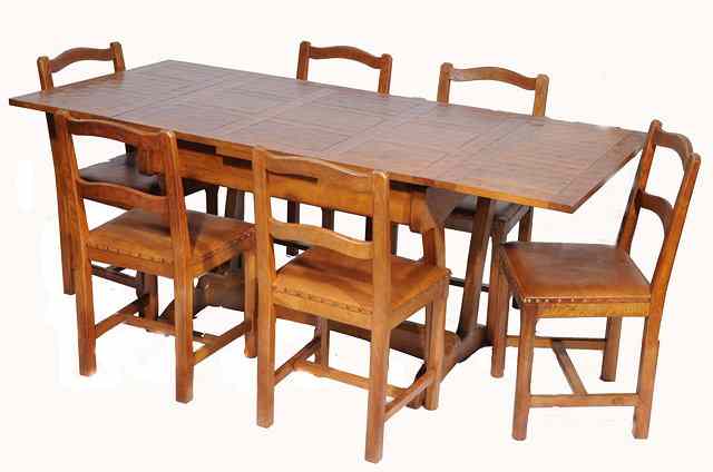 Appraisal: An Alan 'Acornman' Grainger oak dining set the extending dining