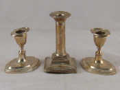 Appraisal: A pair of dwarf silver candlesticks in the Adam manner