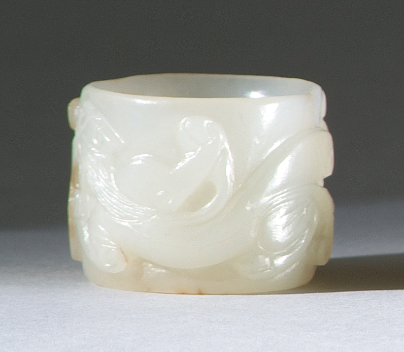 Appraisal: WHITE AND RUSSET JADE THUMB RING Circa White ruyi and