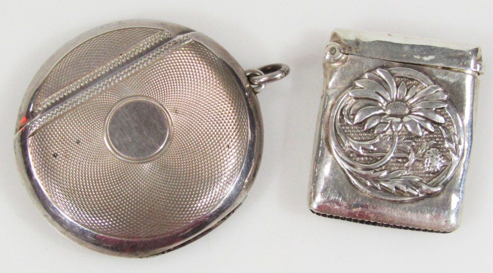 Appraisal: An Edwardian silver vesta case of plain circular outline part