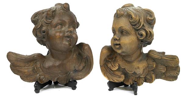 Appraisal: Two carved walnut amorini height in width in depth in