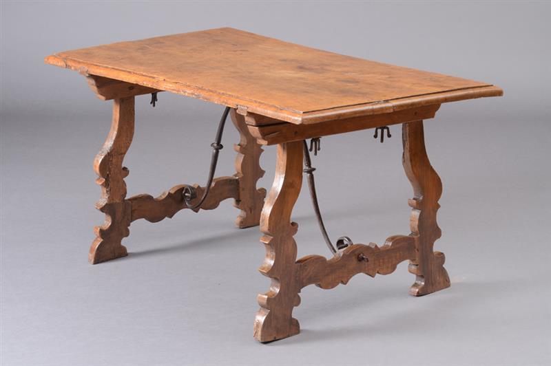 Appraisal: SPANISH BAROQUE WALNUT TRESTLE TABLE The molded rectangular top raised