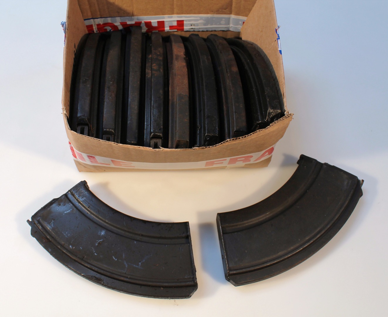 Appraisal: Various Bren gun magazines each in shaped metal cases cm