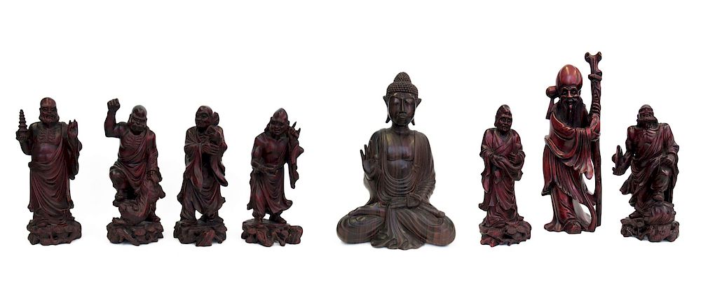 Appraisal: Group of Carved Wood Figures Incl Buddha One carved rosewood