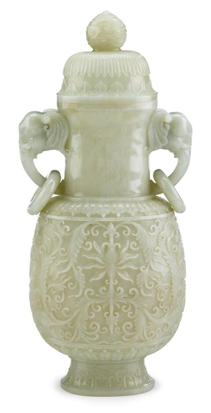 Appraisal: Large Chinese carved white jade Mughal-style covered vaseCloud-carved tall finial-surmounted