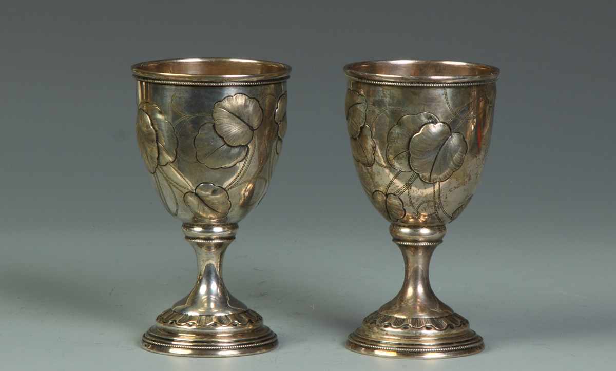 Appraisal: Pair of Silver Goblets Relief hand chased water lily decoration