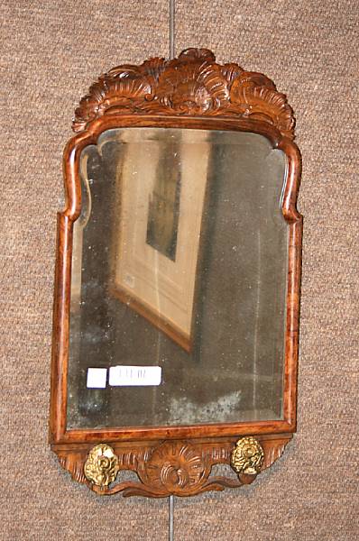 Appraisal: A Continental Baroque walnut mirror th century height in width