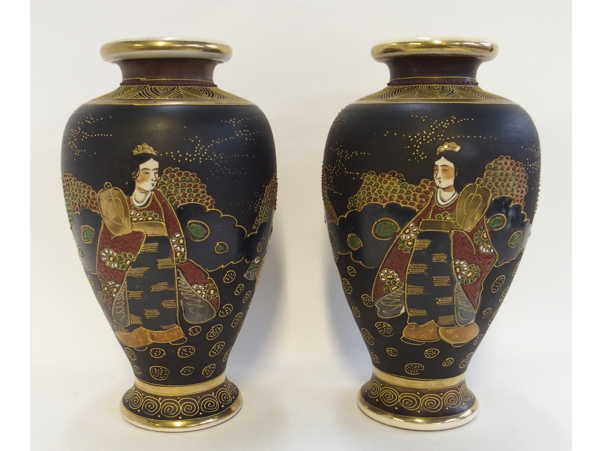 Appraisal: A pair of Japanese Satsuma vases decorated with immortal and