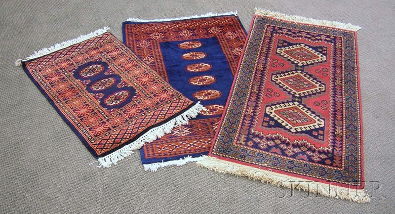 Appraisal: Two Pakistani Rugs and a Machine-made Rug th century one