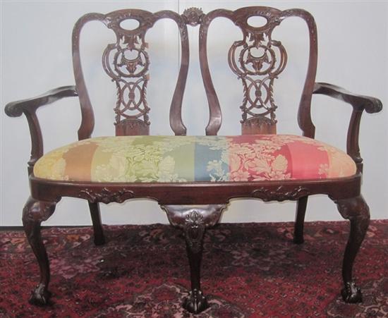 Appraisal: SETTEE A Georgian style carved mahogany settee on ball and