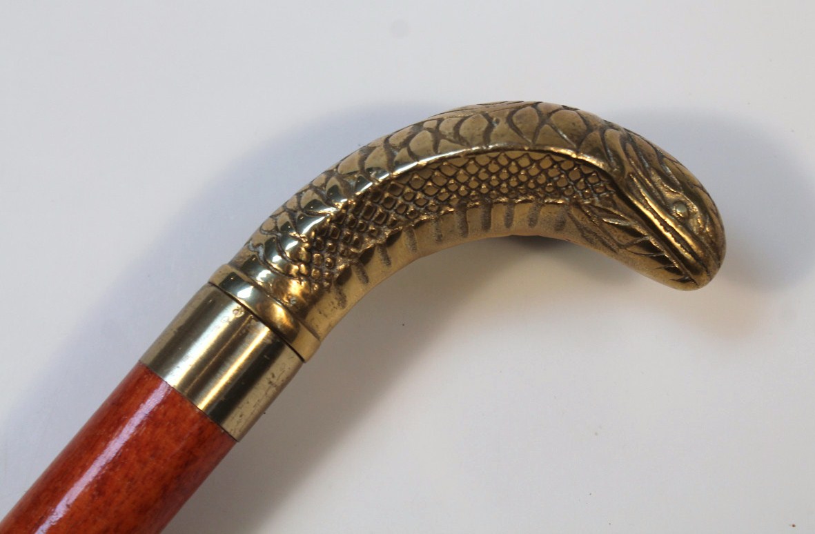 Appraisal: A thC polished wooden dram walking stick with brass snake