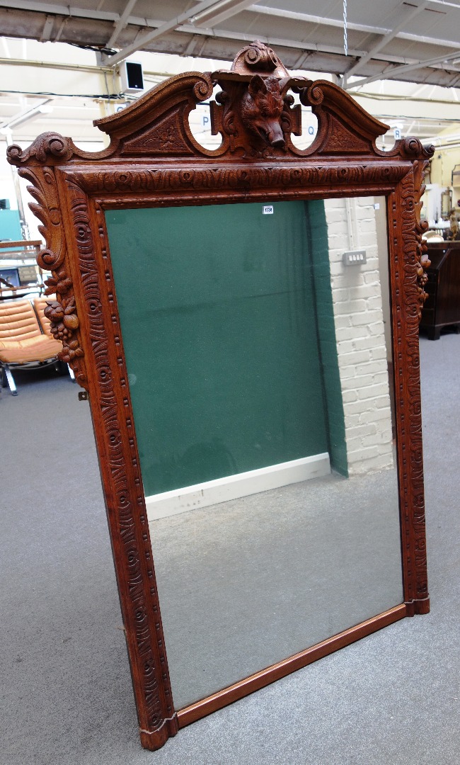 Appraisal: A th century North European carved oak wall mirror the