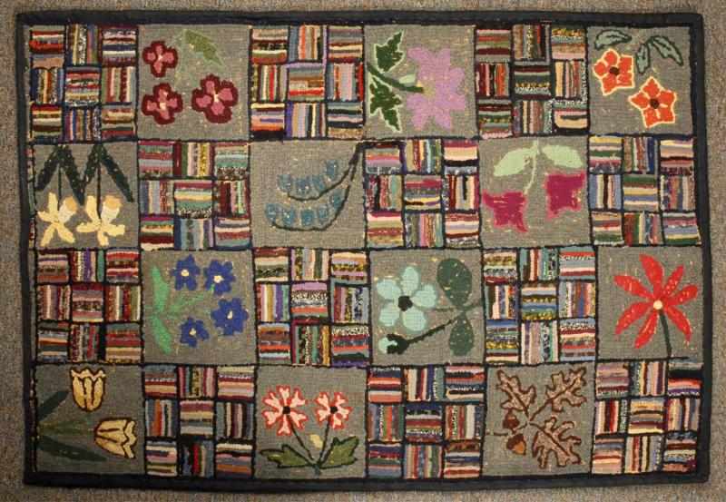 Appraisal: Antique Hooked Rug Description Depicting flowers and a square geometric