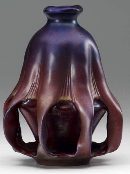 Appraisal: ZSOLNAY Vase with eight twisted buttresses covered in a nacreous