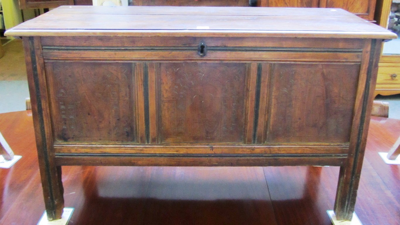 Appraisal: A th century fruitwood coffer the plank top over triple