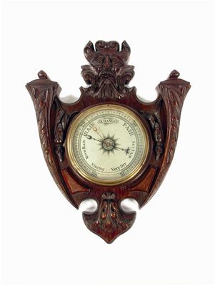 Appraisal: An Irish aneroid barometer having a silvered dial and set