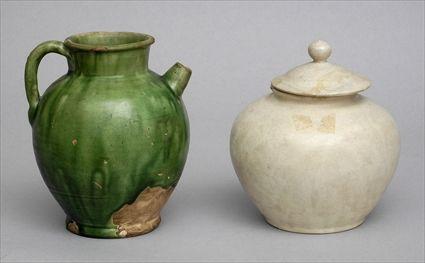 Appraisal: TWO TANG GLAZED POTTERY ARTICLES The larger a green drip