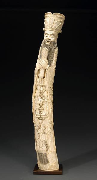 Appraisal: A tinted and pieced ivory figure of a sage emperor