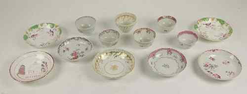 Appraisal: A Newhall tea bowl and saucer with gilded swags and