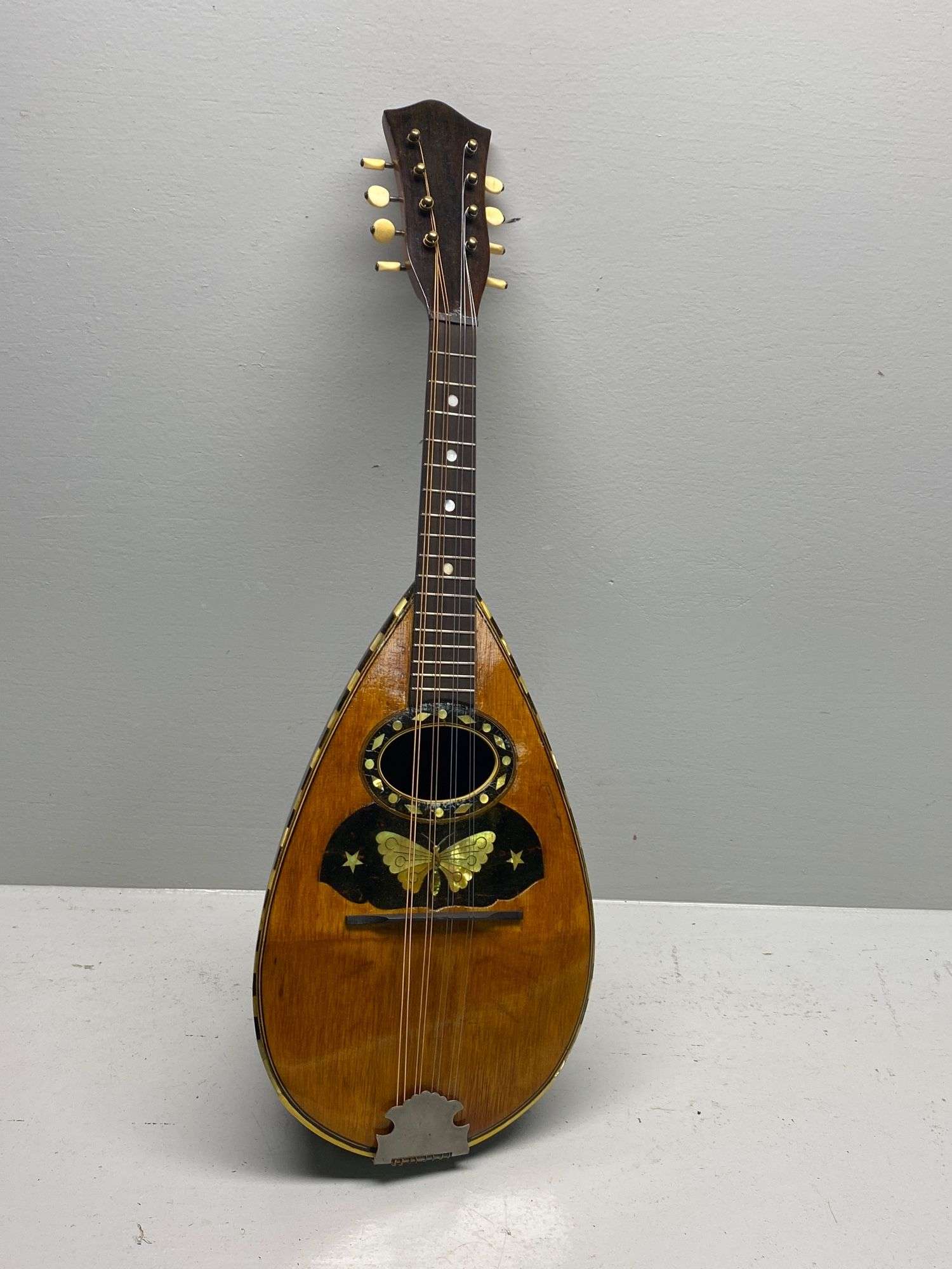 Appraisal: Antique bowl back mandolin with butterfly inlayAntique bowl back mandolin