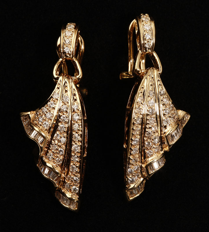 Appraisal: A pair of K yellow gold and diamond ribbon earrings