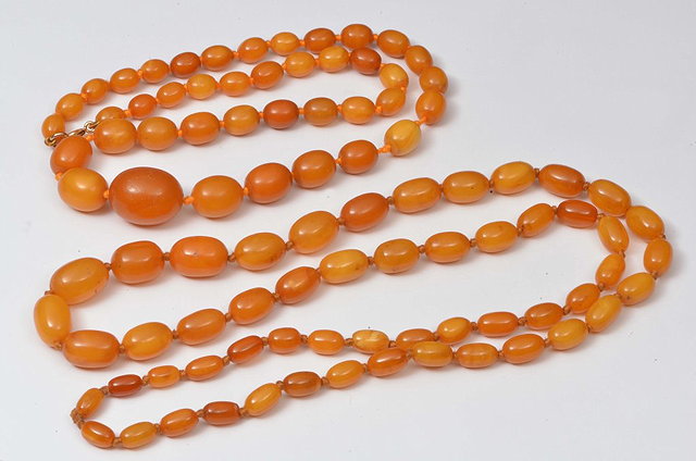 Appraisal: TWO YELLOW AMBER GRADUATED BEAD NECKLACES grams