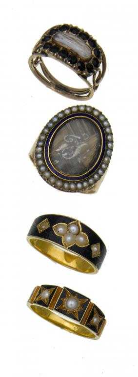 Appraisal: FOUR ENGLISH GOLD AND ENAMEL MOURNING RINGS one with oval