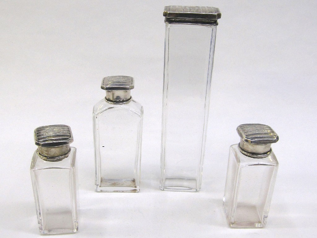 Appraisal: Set of four sterling silver topped dressing table jars