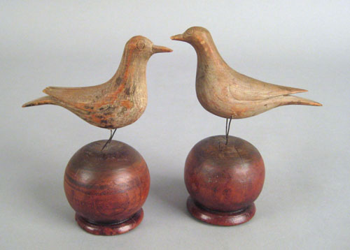 Appraisal: Pair of Pennsylvania carved and painted birds on stands late