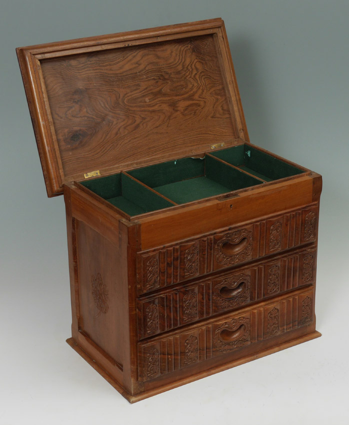 Appraisal: CARVED WALNUT LIFT TOP BOX Lift top over three drawers